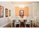 Bright dining room with white table and chairs, featuring an accent wall at 1847 Pacific Dunes Dr, Sun City Center, FL 33573