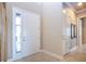 Bright entryway with tiled floors and white doors at 1847 Pacific Dunes Dr, Sun City Center, FL 33573