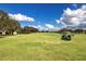 Golf course with golf carts at 1847 Pacific Dunes Dr, Sun City Center, FL 33573