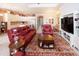 Open living room with a view of kitchen and dining area at 1847 Pacific Dunes Dr, Sun City Center, FL 33573