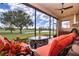 Outdoor kitchen and seating area with golf course view at 1847 Pacific Dunes Dr, Sun City Center, FL 33573