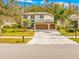 Two-story house with brown garage doors and a manicured lawn at 18801 Chaville Rd, Lutz, FL 33558