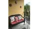 Relaxing balcony with wicker furniture and colorful pillows at 1910 E Palm Ave # 10303, Tampa, FL 33605