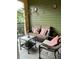 Cozy balcony with wicker furniture and decorative accents at 1910 E Palm Ave # 10303, Tampa, FL 33605