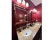 Double vanity bathroom with granite countertop and large mirror at 1910 E Palm Ave # 10303, Tampa, FL 33605