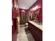 Bathroom boasts granite countertop, double vanity, and shower at 1910 E Palm Ave # 10303, Tampa, FL 33605
