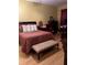 Bedroom with a comfortable bed and wooden furniture at 1910 E Palm Ave # 10303, Tampa, FL 33605