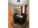 Elegant dining room with glass table and black chairs at 1910 E Palm Ave # 10303, Tampa, FL 33605