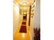 Light and airy hallway, featuring hardwood floors and artwork at 1910 E Palm Ave # 10303, Tampa, FL 33605