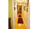 Bright hallway with hardwood floors and access to bedrooms at 1910 E Palm Ave # 10303, Tampa, FL 33605