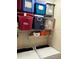 Laundry room with washer, dryer and storage shelves at 1910 E Palm Ave # 10303, Tampa, FL 33605
