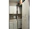 Well-lit laundry room with washer, dryer, and ample storage at 1910 E Palm Ave # 10303, Tampa, FL 33605