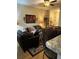 Cozy living room with dark leather sofas and decorative pillows at 1910 E Palm Ave # 10303, Tampa, FL 33605