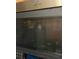 Stainless steel Whirlpool microwave installed above the oven at 1910 E Palm Ave # 10303, Tampa, FL 33605