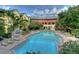 Resort-style pool with surrounding lounge chairs at 1910 E Palm Ave # 10303, Tampa, FL 33605