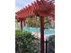 Refreshing community pool area with pergola and lush landscaping at 1910 E Palm Ave # 10303, Tampa, FL 33605