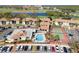 Community aerial view showcasing pool, tennis courts, and clubhouse at 1945 Pelican Landing Blvd # 616, Clearwater, FL 33762