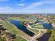 Aerial view of golf course with water features at 1945 Pelican Landing Blvd # 616, Clearwater, FL 33762