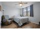 Cozy bedroom with a striped comforter and plenty of natural light at 1945 Pelican Landing Blvd # 616, Clearwater, FL 33762