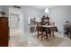 Dining area with table, chairs, and kitchen view at 1945 Pelican Landing Blvd # 616, Clearwater, FL 33762