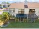 Rear exterior view showing the building and screened porch at 1945 Pelican Landing Blvd # 616, Clearwater, FL 33762