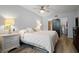 King-size bed, ample closet space, and light flooring in this main bedroom at 1945 Pelican Landing Blvd # 616, Clearwater, FL 33762
