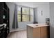 Home office with large window, desk, and built-in shelving at 1945 Pelican Landing Blvd # 616, Clearwater, FL 33762