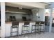 Outdoor kitchen with grill and seating for entertaining at 1945 Pelican Landing Blvd # 616, Clearwater, FL 33762