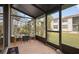 Cozy screened porch with outdoor seating, overlooking the grounds at 1945 Pelican Landing Blvd # 616, Clearwater, FL 33762