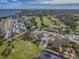 Aerial shot showcasing golf course, clubhouse, and condo buildings in the community at 2700 Cove Cay Dr # 2F, Clearwater, FL 33760