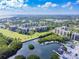 Aerial view of community, including tennis courts, boat marina, and condo buildings at 2700 Cove Cay Dr # 2F, Clearwater, FL 33760