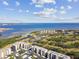 Aerial view showcasing the community's bay views, golf course, and condo buildings at 2700 Cove Cay Dr # 2F, Clearwater, FL 33760