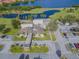 Aerial view of Cove Cay with golf course, lake, clubhouse, parking, and lush landscaping at 2700 Cove Cay Dr # 2F, Clearwater, FL 33760