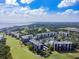 An aerial view of the condo buildings with a view of the Tampa Bay bridge at 2700 Cove Cay Dr # 2F, Clearwater, FL 33760
