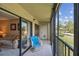 Cozy balcony with seating offers views of landscaped grounds and clear skies at 2700 Cove Cay Dr # 2F, Clearwater, FL 33760