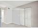Bright bedroom features neutral walls and carpet, with a closet for storage at 2700 Cove Cay Dr # 2F, Clearwater, FL 33760