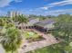 Spacious clubhouse with outdoor seating and lush landscaping with tropical palm trees at 2700 Cove Cay Dr # 2F, Clearwater, FL 33760