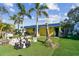 Playful outdoor space with giant chess, clubhouse, and tropical landscaping at 2700 Cove Cay Dr # 2F, Clearwater, FL 33760