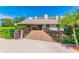 Community clubhouse with palm trees in a beautiful tropical setting at 2700 Cove Cay Dr # 2F, Clearwater, FL 33760