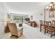 Inviting open-concept living and dining area with slider doors to balcony at 2700 Cove Cay Dr # 2F, Clearwater, FL 33760