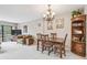 Living room boasts a dining table and slider door access to the balcony at 2700 Cove Cay Dr # 2F, Clearwater, FL 33760