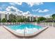 Community pool and condos with plenty of lounge chairs for residents to enjoy at 2700 Cove Cay Dr # 2F, Clearwater, FL 33760