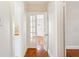Hallway with French doors leading to a naturally lit room at 323 W Hanna Ave, Tampa, FL 33604