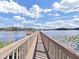 Wooden dock extending over calm lake waters at 3406 Heards Ferry Dr, Tampa, FL 33618