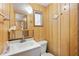 Small half bathroom with a toilet and vanity at 39045 Sabal Ave, Zephyrhills, FL 33542