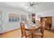 Dining room with wood table and chairs, kitchen view at 39045 Sabal Ave, Zephyrhills, FL 33542