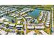 Community overview: buildings, pool, lake, and surrounding area at 4235 Stratford Dr, New Port Richey, FL 34652