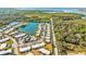 Community overview: buildings, lake, road, and mangrove area at 4235 Stratford Dr, New Port Richey, FL 34652
