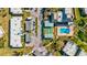 Aerial view of community with pool, shuffleboard, and building exteriors at 4235 Stratford Dr, New Port Richey, FL 34652