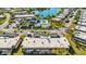 Condo building with covered parking and lake view at 4235 Stratford Dr, New Port Richey, FL 34652
